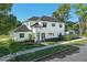 Beautiful two-story home with a well-manicured lawn and mature landscaping at 500 W Hazel St, Orlando, FL 32804