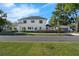 A modern two-story home with clean lines, manicured landscaping, and detached garage at 500 W Hazel St, Orlando, FL 32804