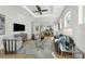 Spacious living room with modern furniture, a ceiling fan, and an open floor plan at 500 W Hazel St, Orlando, FL 32804