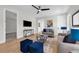 Comfortable living room with light floors, modern decor, ceiling fan, and lots of natural light at 500 W Hazel St, Orlando, FL 32804
