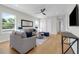 Bright living room with neutral colors, light wood floors, modern ceiling fan, and ample natural light at 500 W Hazel St, Orlando, FL 32804
