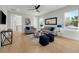 Spacious living room featuring wood floors, stylish furnishings, and plenty of natural light from large windows at 500 W Hazel St, Orlando, FL 32804