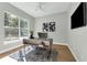Office space featuring a modern desk, large window, wood floors, and plenty of natural light at 500 W Hazel St, Orlando, FL 32804