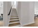 A bright, wood staircase leads to the second story, where the dining and living area can be seen at 500 W Hazel St, Orlando, FL 32804