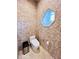 Elegant bathroom with mosaic tile, modern toilet, and octagon window at 5001 Latrobe Dr, Windermere, FL 34786