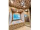 Bathroom features a soaking tub, walk-in shower, and stone tile at 5001 Latrobe Dr, Windermere, FL 34786