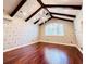 Spacious bedroom with hardwood floors, high ceilings, and unique wall decor at 5001 Latrobe Dr, Windermere, FL 34786
