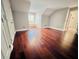 Bright bedroom featuring hardwood floors and built-in shelving at 5001 Latrobe Dr, Windermere, FL 34786