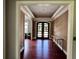 Bright entryway with hardwood floors and modern console table at 5001 Latrobe Dr, Windermere, FL 34786