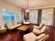 Spacious Gathering room featuring hardwood floors and French doors at 5001 Latrobe Dr, Windermere, FL 34786