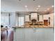 Modern kitchen with granite countertops and white cabinets at 5001 Latrobe Dr, Windermere, FL 34786