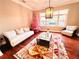 Living room with hardwood floors, pink tree and comfy seating at 5001 Latrobe Dr, Windermere, FL 34786