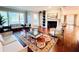 Spacious living room with hardwood floors, fireplace and seating at 5001 Latrobe Dr, Windermere, FL 34786