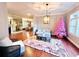 Spacious living room with hardwood floors and fireplace at 5001 Latrobe Dr, Windermere, FL 34786