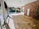 Spacious screened porch with tile flooring and outdoor kitchen at 5001 Latrobe Dr, Windermere, FL 34786