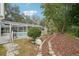 Landscaped backyard with a path leading to the pool area at 5032 River Lake Rd, Winter Haven, FL 33884