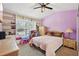Bright bedroom with built-in shelving and window seat at 5032 River Lake Rd, Winter Haven, FL 33884