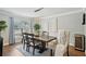 Elegant dining room with hardwood floors and large windows at 5032 River Lake Rd, Winter Haven, FL 33884