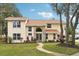Two-story house with stone accents and landscaping at 5032 River Lake Rd, Winter Haven, FL 33884
