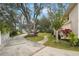 Landscaped yard with a winding pathway and trees at 5032 River Lake Rd, Winter Haven, FL 33884