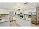 Bright kitchen with granite countertops, stainless steel appliances, and hardwood floors at 5032 River Lake Rd, Winter Haven, FL 33884