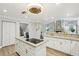 Updated kitchen featuring granite countertops, stainless steel appliances, and an island at 5032 River Lake Rd, Winter Haven, FL 33884