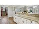 Large kitchen with granite countertops and white cabinetry at 5032 River Lake Rd, Winter Haven, FL 33884
