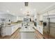 Modern kitchen with granite countertops, stainless steel appliances, and hardwood floors at 5032 River Lake Rd, Winter Haven, FL 33884