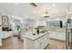 Open concept kitchen boasting granite countertops and stainless steel appliances at 5032 River Lake Rd, Winter Haven, FL 33884
