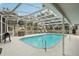 Relaxing screened-in pool area with patio furniture at 5032 River Lake Rd, Winter Haven, FL 33884