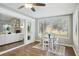 Spacious sunroom with large windows, hardwood floors, and a dining area at 5032 River Lake Rd, Winter Haven, FL 33884