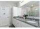 Double vanity bathroom with granite countertop and spacious layout at 606 Urick St, Fruitland Park, FL 34731