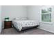 Bedroom with a double bed and wooden night stand at 606 Urick St, Fruitland Park, FL 34731