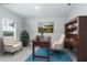 Bright home office with built in shelving and comfortable armchairs at 606 Urick St, Fruitland Park, FL 34731