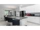Spacious kitchen, granite countertops, stainless steel appliances, and an island at 606 Urick St, Fruitland Park, FL 34731
