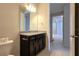 Bathroom with granite countertop and dark brown vanity at 6554 Rover Way, St Cloud, FL 34771