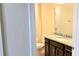 Bathroom with granite countertop and dark brown vanity at 6554 Rover Way, St Cloud, FL 34771