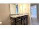 Bathroom with granite countertop and dark brown vanity at 6554 Rover Way, St Cloud, FL 34771