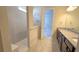 Modern bathroom with double vanity and walk-in shower at 6554 Rover Way, St Cloud, FL 34771