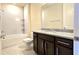 Clean bathroom with shower/tub combo and granite vanity at 6554 Rover Way, St Cloud, FL 34771