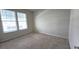 Spacious bedroom with neutral carpeting and two windows at 6554 Rover Way, St Cloud, FL 34771