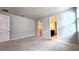 Large bedroom with carpet and access to bathroom and closet at 6554 Rover Way, St Cloud, FL 34771