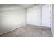 Empty bedroom with neutral carpeting and door at 6554 Rover Way, St Cloud, FL 34771