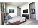 Bedroom with a large closet and mounted TV at 6554 Rover Way, St Cloud, FL 34771