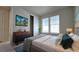 Bedroom with queen-size bed and dresser at 6554 Rover Way, St Cloud, FL 34771