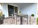 Covered patio furnished with table and chairs for outdoor dining at 6554 Rover Way, St Cloud, FL 34771