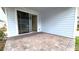 Covered patio with brick pavers and access to backyard at 6554 Rover Way, St Cloud, FL 34771
