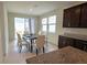 Dining area with patio access and seating for six at 6554 Rover Way, St Cloud, FL 34771