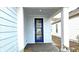 Blue front door with glass panels leading into the home at 6554 Rover Way, St Cloud, FL 34771