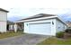 Attached garage with solar panels on the roof at 6554 Rover Way, St Cloud, FL 34771